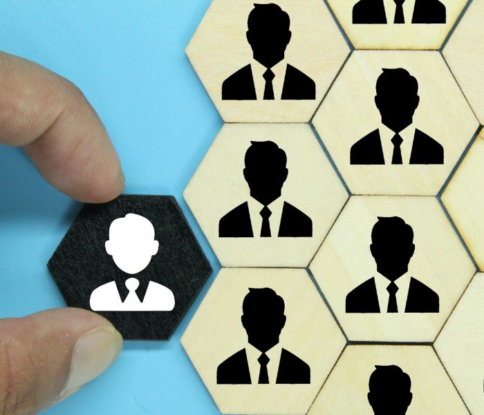 hexagon with an old employee icon and a new employee. the concept of workers or HR